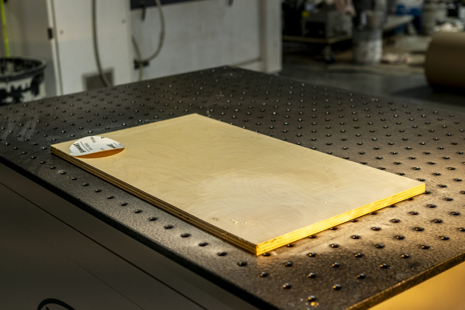 A workpiece resting flat on the perforated wood downdraft top